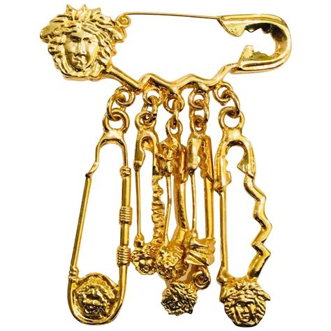 versace pin brooch.